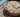 A cat lies on a cat cushion