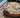 A cat lies on a cat cushion